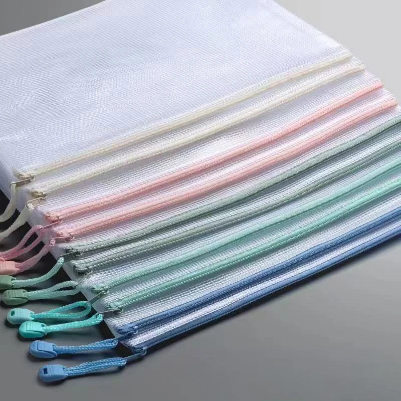 A stack of various colored mesh zipper document bags for storage.