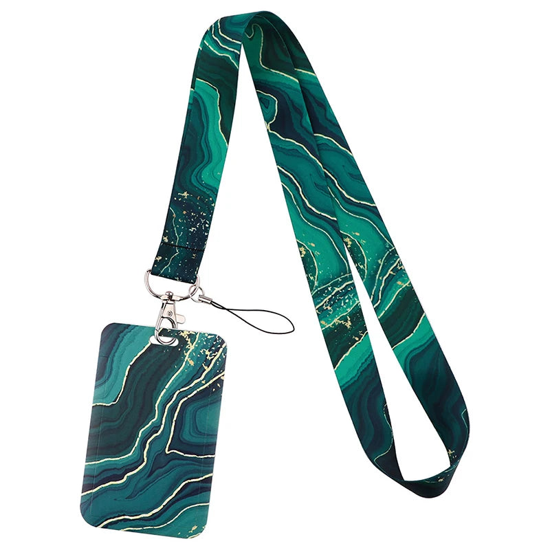 A green and teal marbled fabric lanyard with a metal clip attached to a tag.