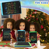 Four children are shown interacting with an 8.5 inch LCD writing tablet for kids in a festive holiday setting.