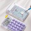 A clear plastic case containing a replaceable battery and an electronic circuit board for a mini silent calculator.