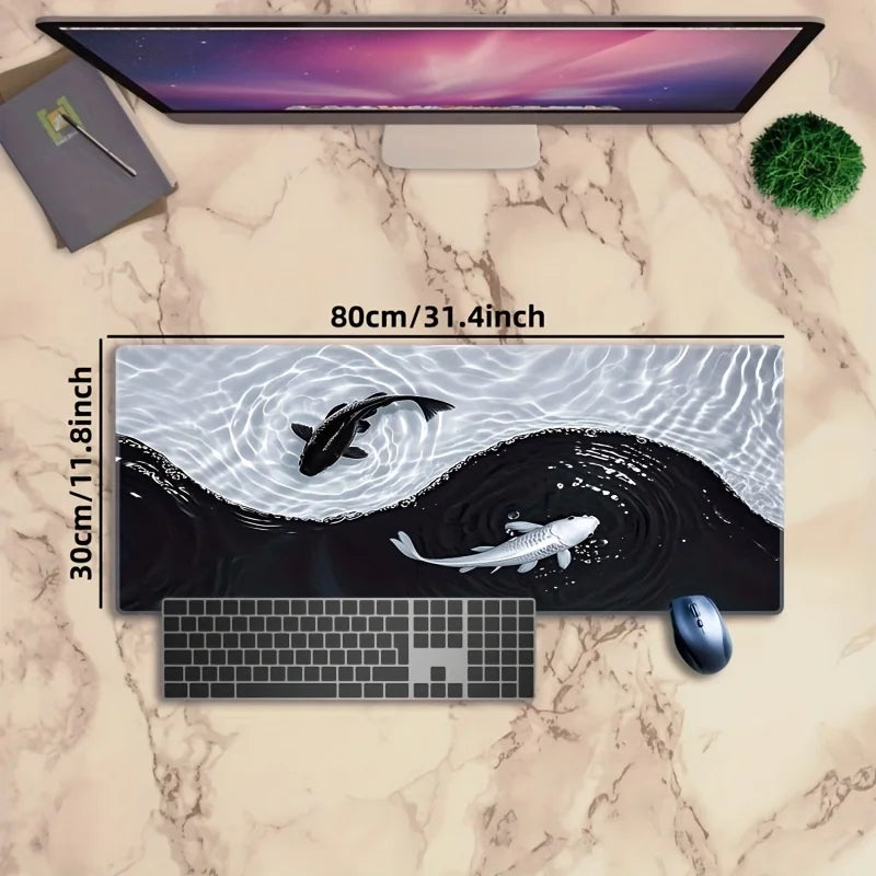 A gaming mouse pad featuring a black and white koi fish pattern on a marble surface with a computer monitor and keyboard.