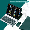 An iPad case featuring a built-in Bluetooth keyboard and mouse, shown open on a white marble surface.