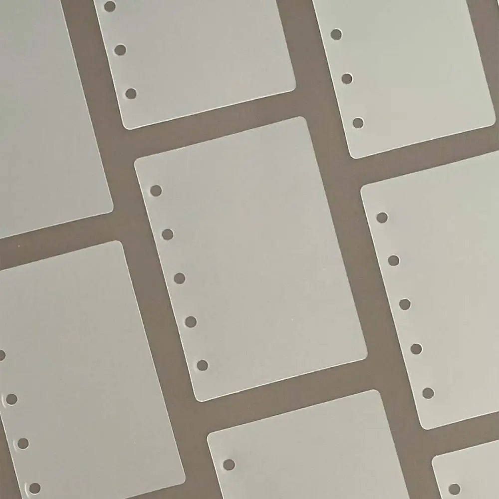 A set of ten transparent divider pages for loose-leaf planners, showing various sizes and layouts.