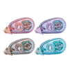 Three transparent adhesive tapes in pink, purple, and blue packaging with silver applicator tips.