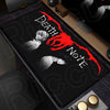 A black mouse pad featuring a Death Note design with a red blood splatter and silhouettes of characters.