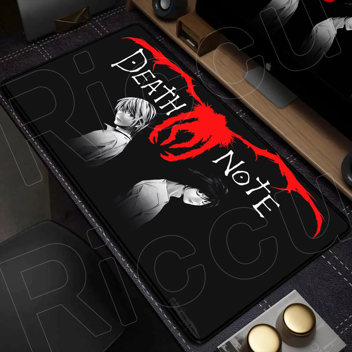 A black mouse pad featuring a Death Note design with a red blood splatter and silhouettes of characters.
