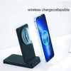 A black magnetic foldable wireless charging stand next to a blue smartphone displaying a 75% charged icon.