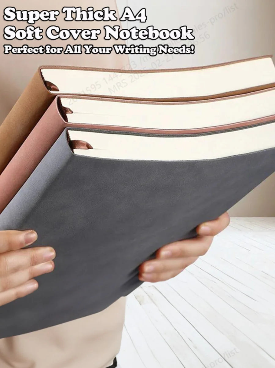 A stack of soft cover notebooks in various colors, including gray and pink, being held by hands.
