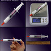 A syringe of GD370 thermal conductive grease paste is shown next to a digital scale and a ruler.