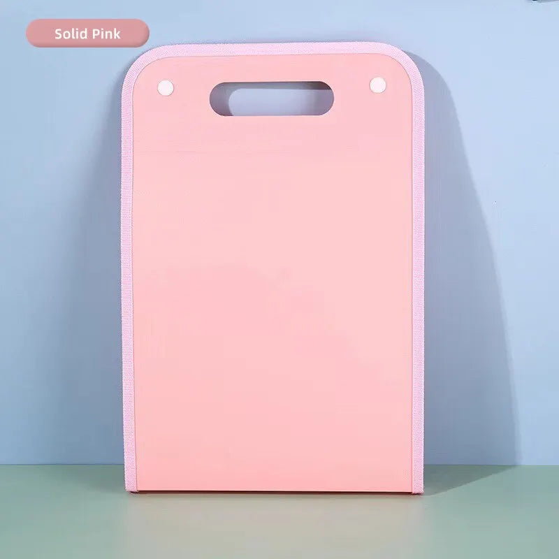 A solid pink portable accordion document organizer with rounded edges and a slot for holding papers.