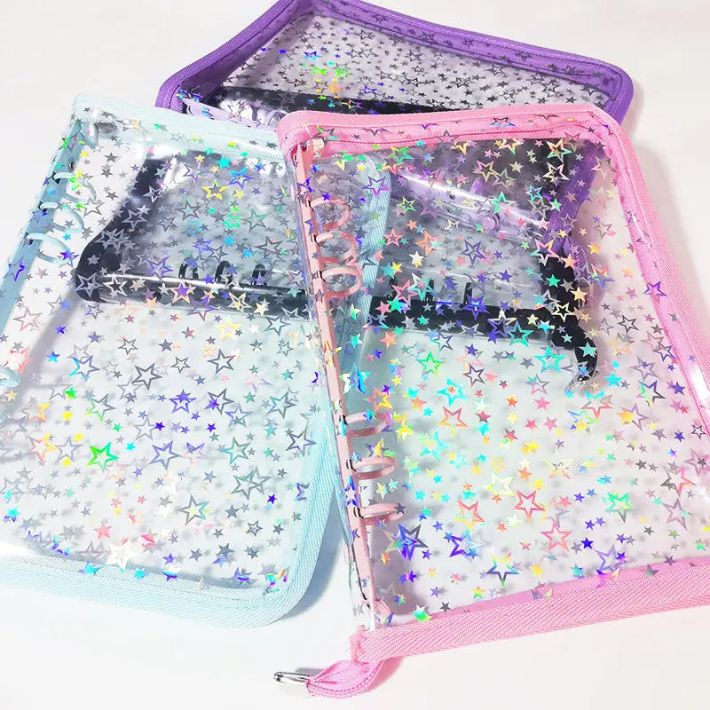 A set of transparent zipper photo binders in purple and pink, featuring glittery star patterns.