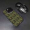 A camouflage patterned phone case for an iPhone next to a black wireless mouse.