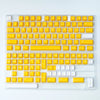 A transparent plastic keyboard featuring yellow keycaps and a white backlight.