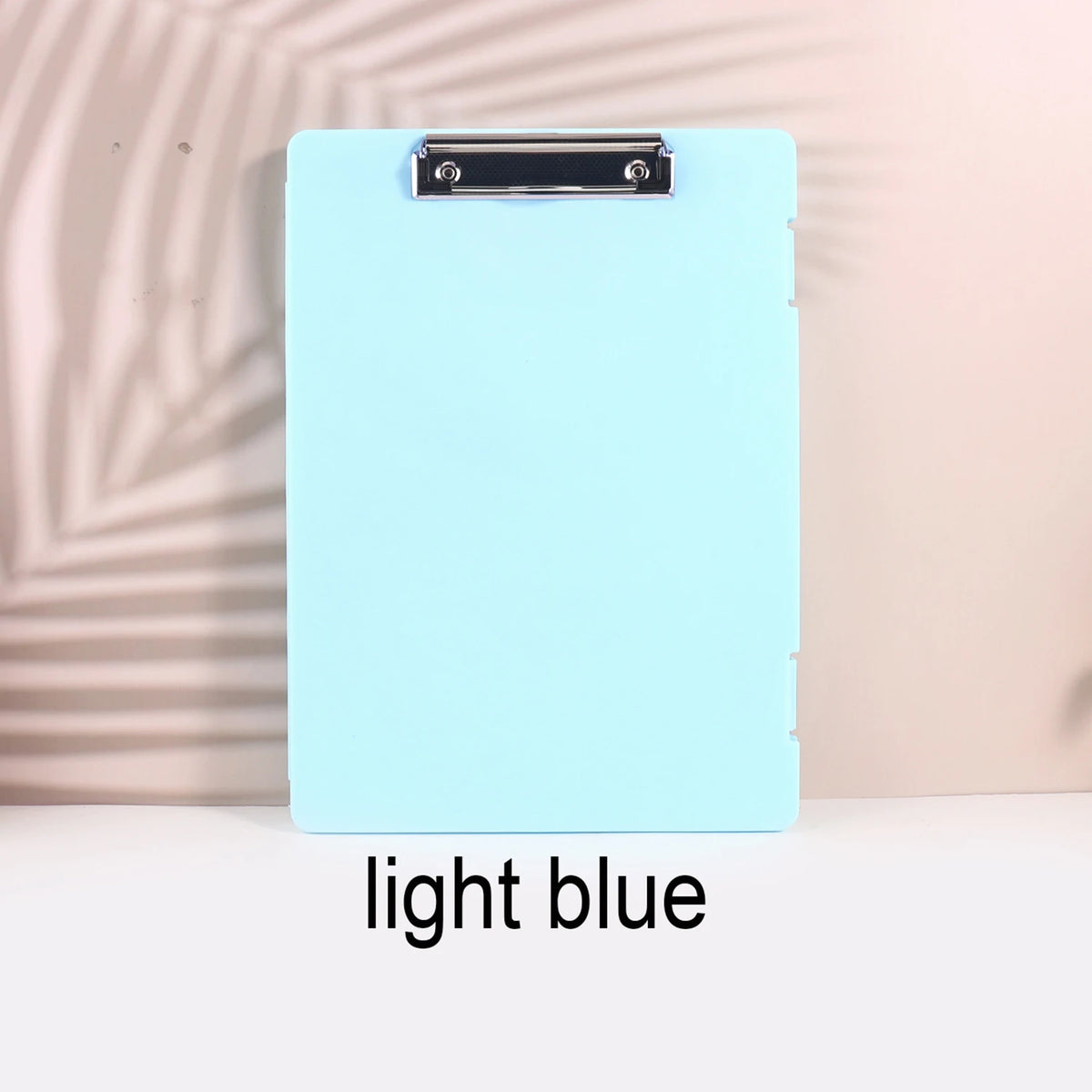 A light blue A4 document and photo storage file box with a silver metal clip.
