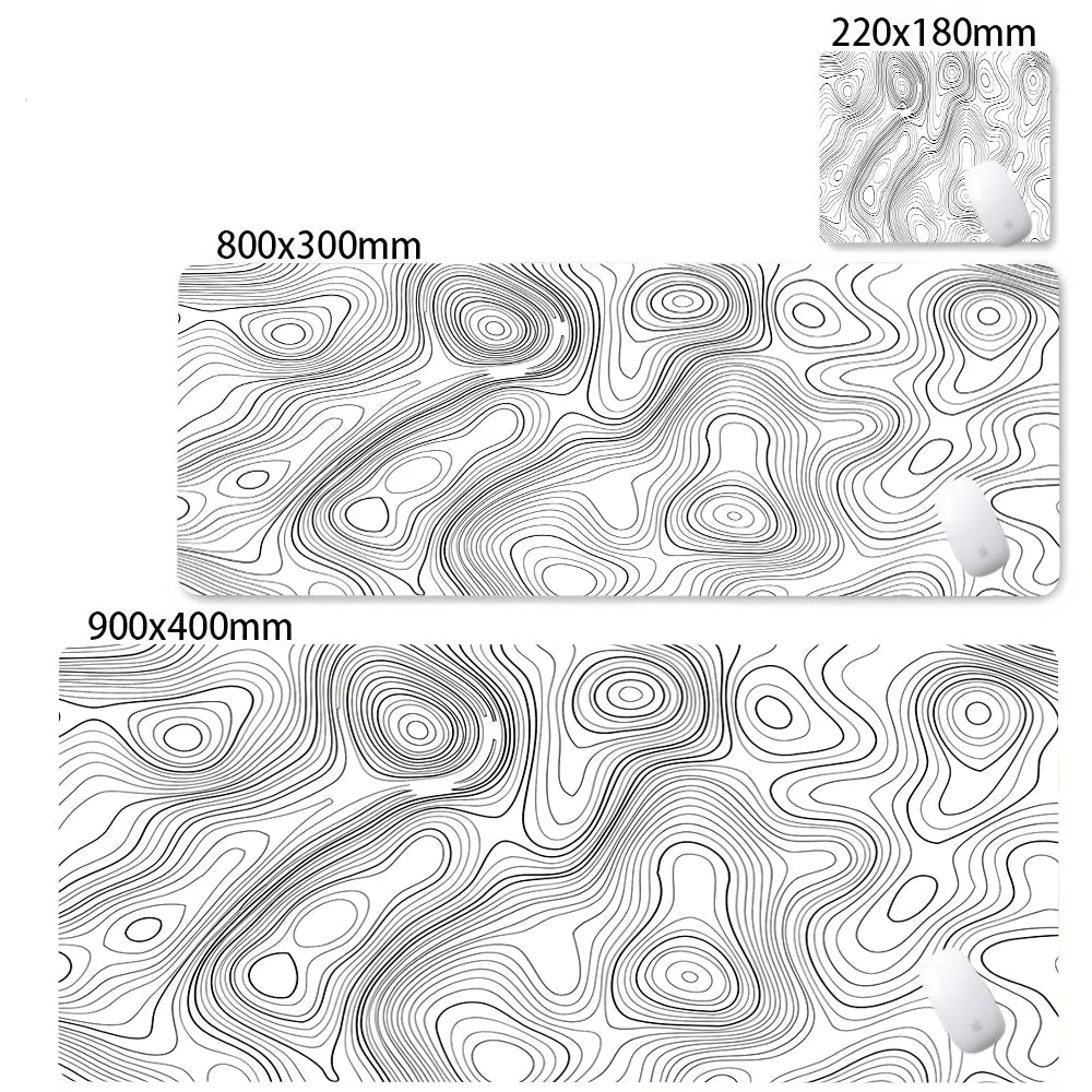 Abstract line design desk mat featuring swirling topographic lines in black and white.