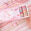 A box of Cute Pink Series Washi Tape with 36 rolls displayed on a patterned fabric.