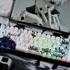 A close-up of a custom mechanical keyboard featuring Kaneki Ken anime keycaps on a PBT Cherry profile set.