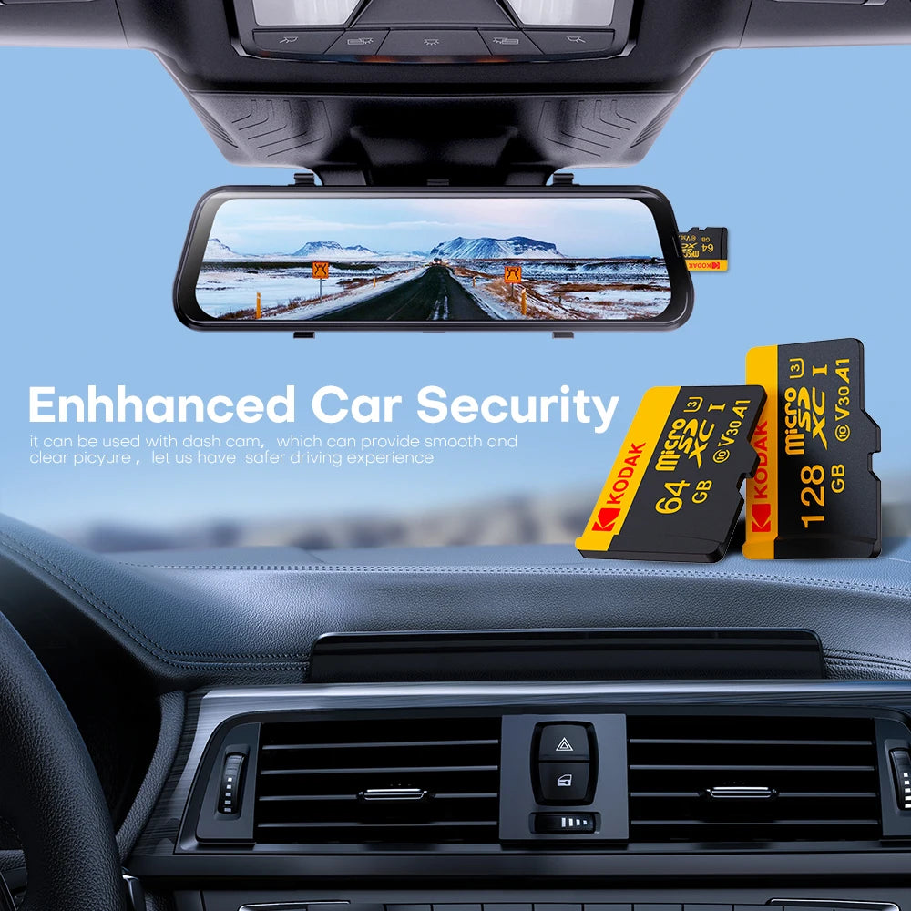 A display showing a clear view through a dashcam mounted on a car's dashboard, with Kodak memory cards visible nearby.
