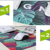 Two gaming mouse pads featuring a vibrant green and purple tropical leaf print, labeled No. 1 and No. 2.