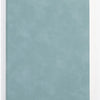 A smooth, light blue leather journal or diary lying flat against a white background.
