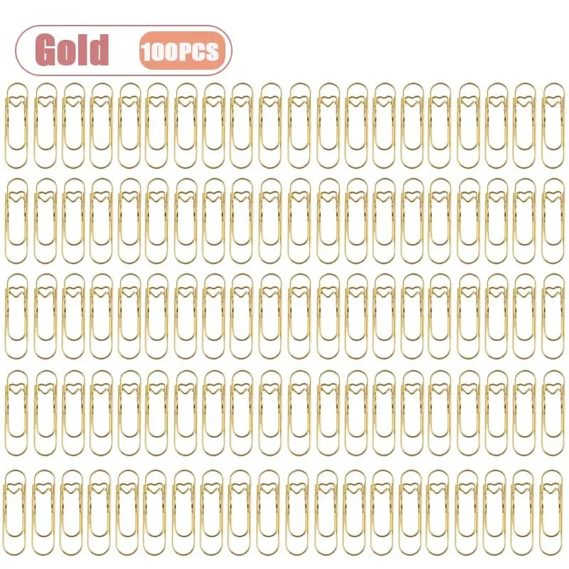 A set of 100 gold metal pen clips designed for notebooks and journals.