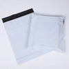 Two white bulk waterproof packaging bags are shown, one partially visible behind another.