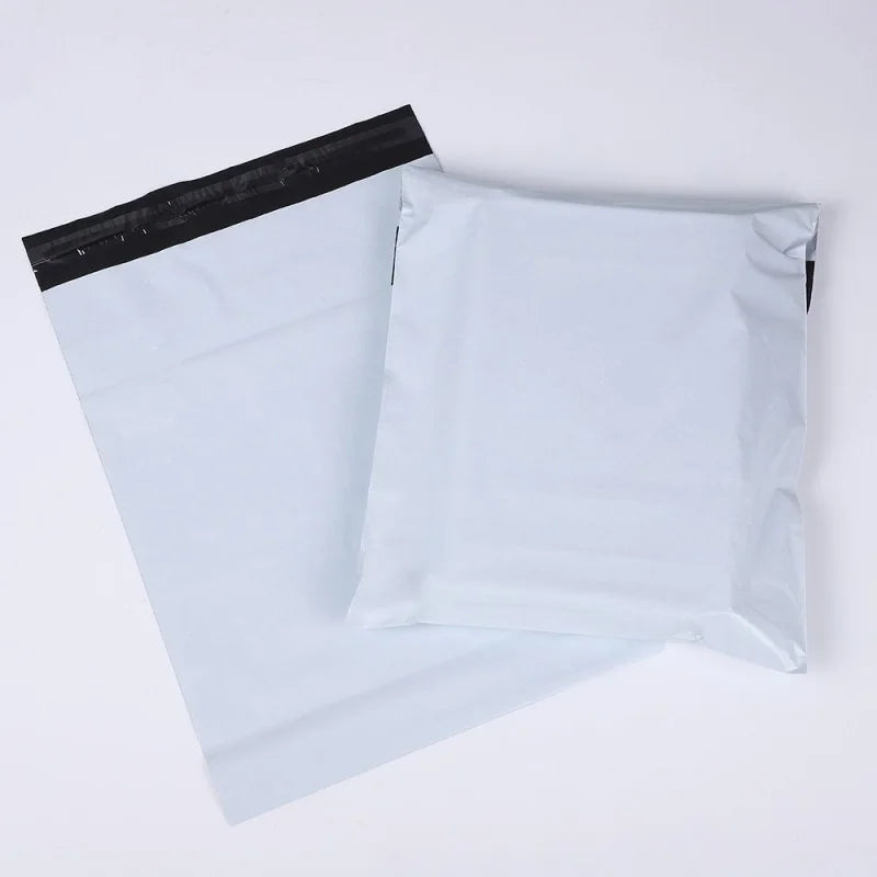 Two white bulk waterproof packaging bags are shown, one partially visible behind another.