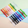 Assortment of colorful silicone watch straps and replacement tools laid out on a light background.