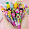A hand holds a cluster of cute cartoon mini ballpoint pens featuring various colorful animal characters.