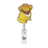 A yellow cat charm with a red collar attached to a silver badge reel.