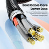 A close-up view of a thick black cable core with gold connectors, demonstrating lower loss charging technology.