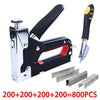 A silver and black heavy duty manual multi-use staple gun with assorted staples and a stapler tool.