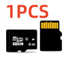One piece of a black MicroSD memory card with a yellow contact area labeled 4 GB.