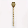 Vintage brass straight ruler with a round, textured tip and minimalist design.