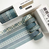 A set of blue plaid washi tape rolls featuring decorative grid and polka dot patterns, displayed in its packaging.