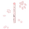 A pink plastic ruler shaped like a cat paw, featuring paw prints and a heart design.