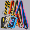 A collection of vintage cassette tape lanyards and an ID badge holder displayed against a gray background.