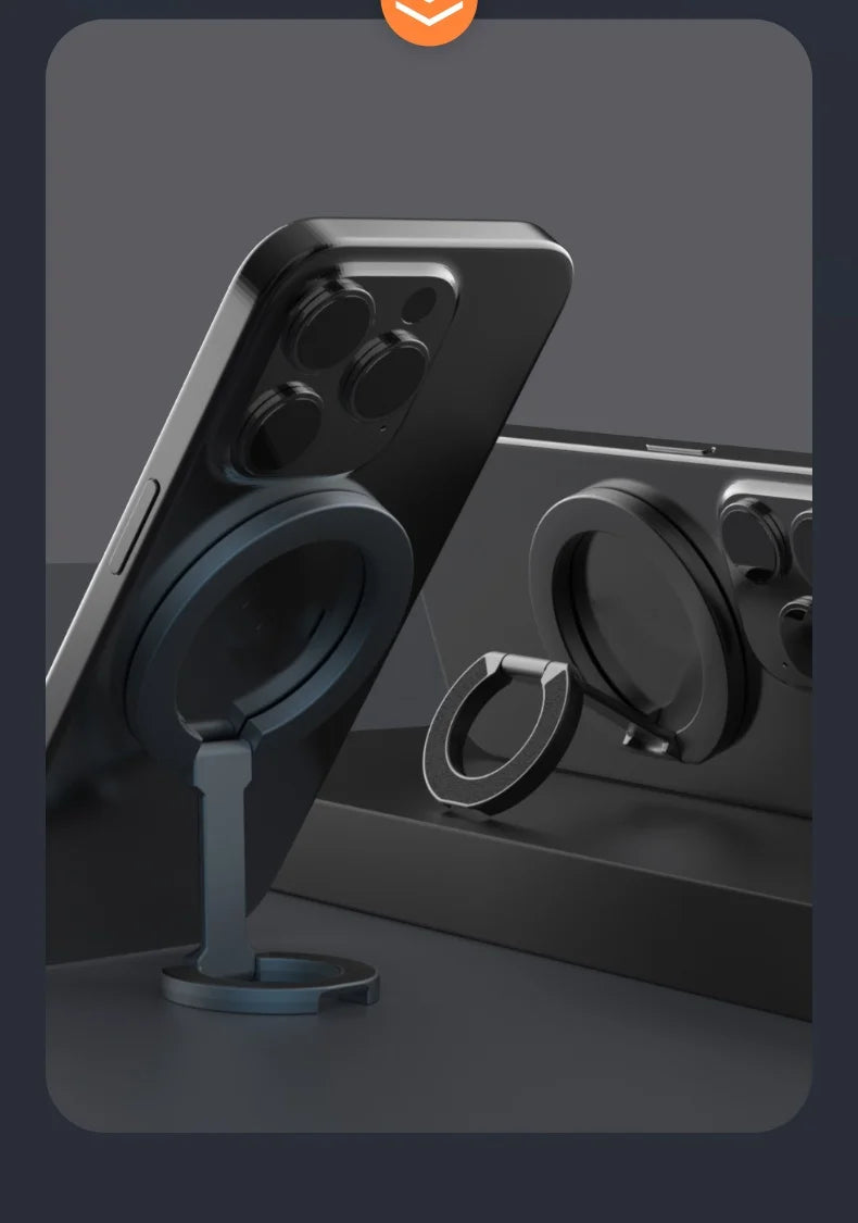A black MagSafe double-sided phone ring holder is shown on a dark surface.