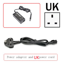 Black power adapter and UK power cord for laptops