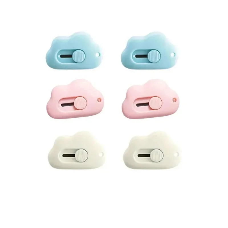 Three variations of a light blue, pink, and white portable rabbit cloud letter opener and crafting tool.