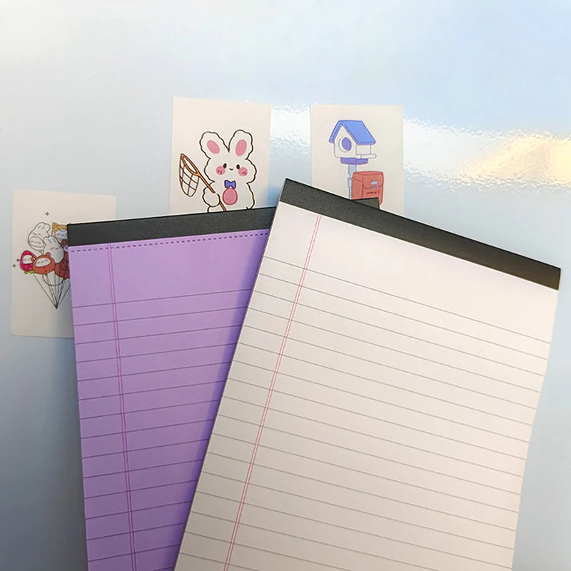 A purple tearable lined writing pad is displayed next to two small cards featuring cute animal and house illustrations.