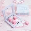 A clear plastic case holds pink cat paw and heart keycaps for MX switches on a pink background.