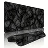 A black desk mat featuring a pattern of rolled and stacked paper currency.