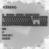 A close-up view of a mechanical keyboard with light gray keycaps and an iceberg graphic background.