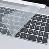 A clear silicone keyboard cover is placed over a laptop keyboard, showing the keys underneath.