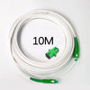 A coil of white single-mode fiber optic cable with green connectors is shown on a white background.
