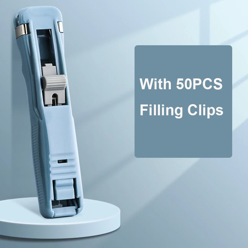 A light blue handheld binder clip pusher tool with a stainless steel refill clip is shown against a gray background.