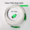 A coil of 3M-120M indoor fiber drop cable with green connectors is shown on a white background.