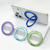 Weißes iPhone-Hülle mit magnetischen Ringhaltern in lila, blau und grün auf weißem Hintergrund.