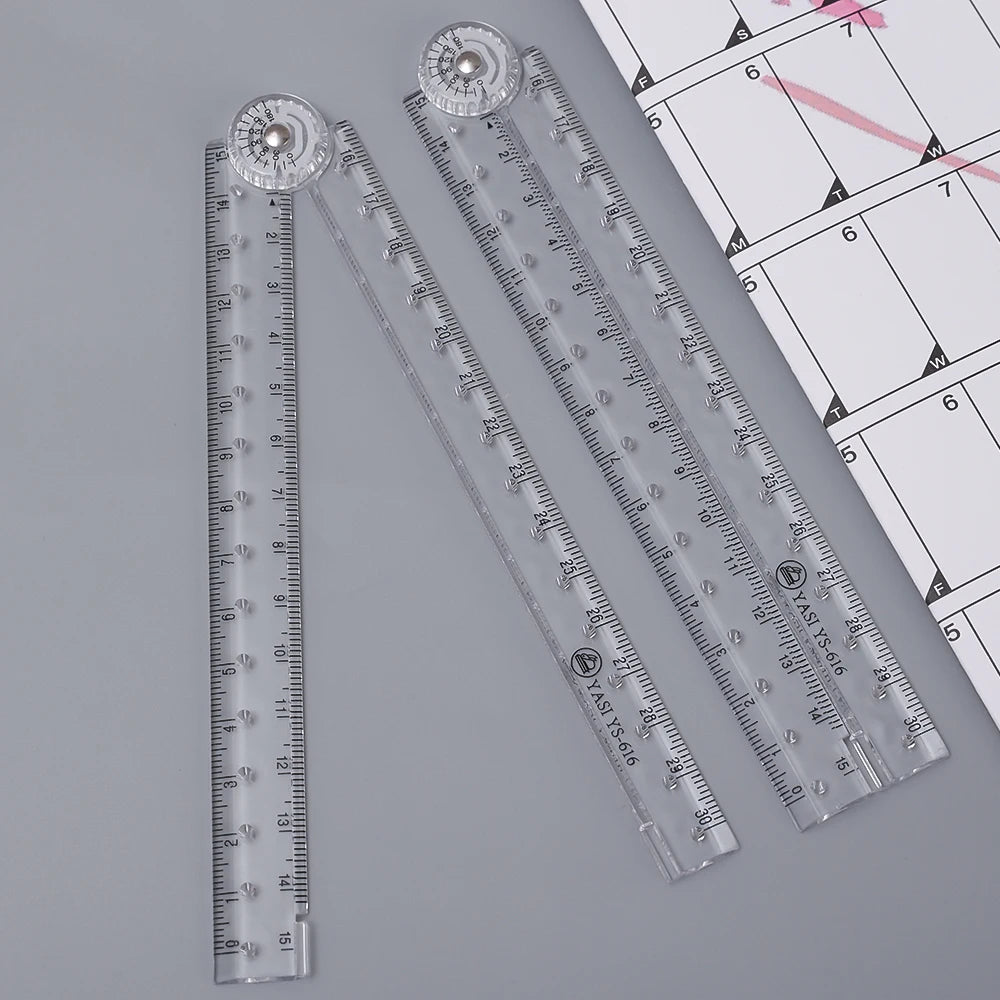 A set of clear acrylic geometry rulers and a grid, showing various measurement scales.